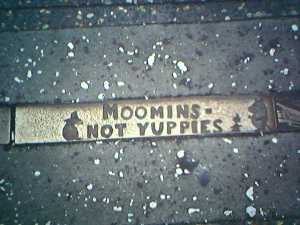 This sidewalk plaque using the bohemian Moomins to critique yuppies was found in Sydney Australia (image courtesy mr. lynch),